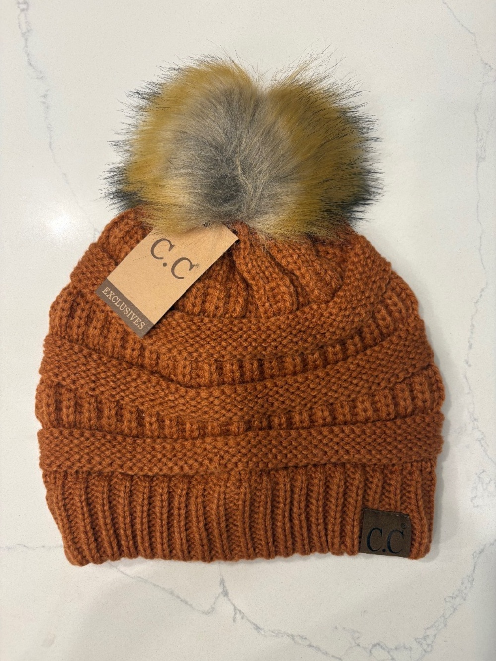 C.C Rust Ribbed Hat With Faux Fur Pom